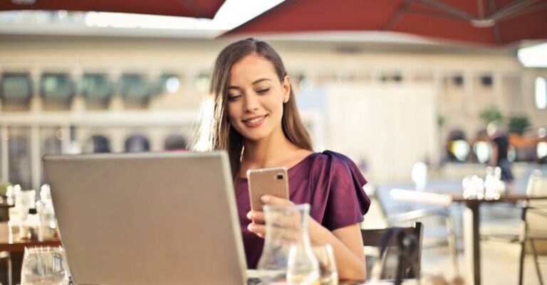 Pc - Woman Wearing Purple Shirt Holding Smartphone White Sitting on Chair