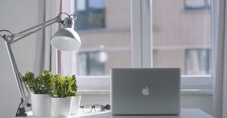 Laptop - Silver Macbook Air and Goose Neck Lamp