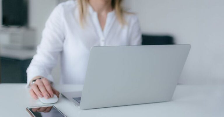 Computer - Woman Using Silver Laptop