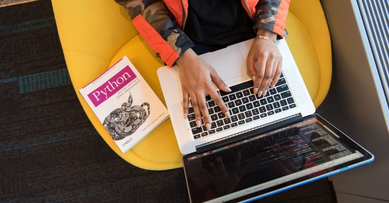 Software - Woman Programming on a Notebook