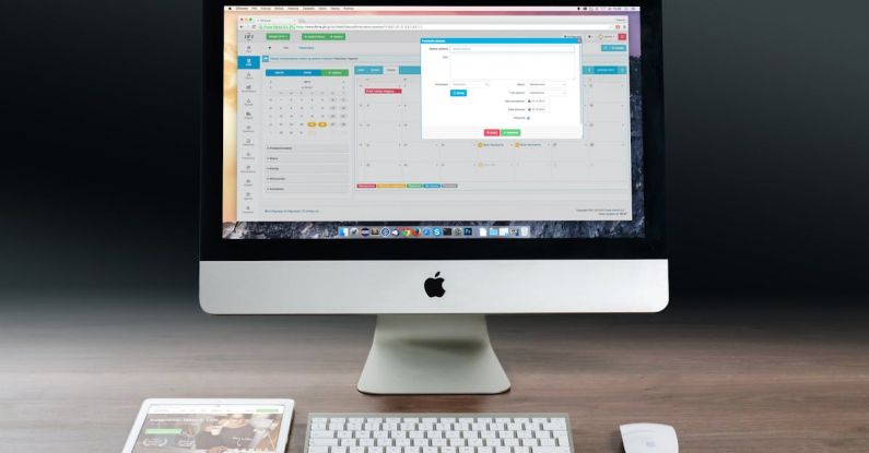 Computer - Silver Imac, Apple Magic Keyboard, and Magic Mouse on Wooden Table