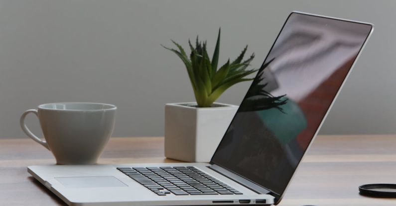 Laptop - Silver Laptop and White Cup on Table