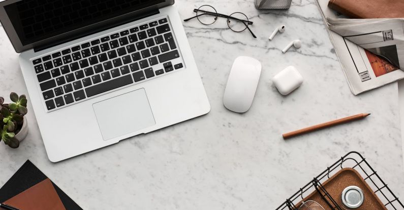 Computer - Flatlay Display of Electronics next to Eyeglases