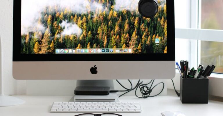 Computer - Turned on Silver Imac With Might Mouse and Keyboard